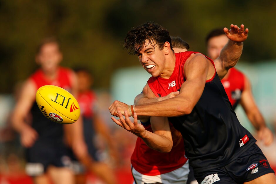 AFL 2019 JLT Community Series - Melbourne v Brisbane MELBOURNE, AUSTRALIA - MARCH 09: Marty Hore of the Demons handballs during the 2019 JLT Community Series AFL match between the Melbourne Demons and the Brisbane Lions at Casey Fields on March 09, 2019 in Melbourne, Australia. (Photo by Darrian Traynor/Getty Images)